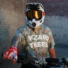 Model wearing the Camo Tee while riding a dirt bike
